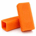 Reusable pet hair remover in orange, two units on a white background showing the raised nubs and hollow rectangular body