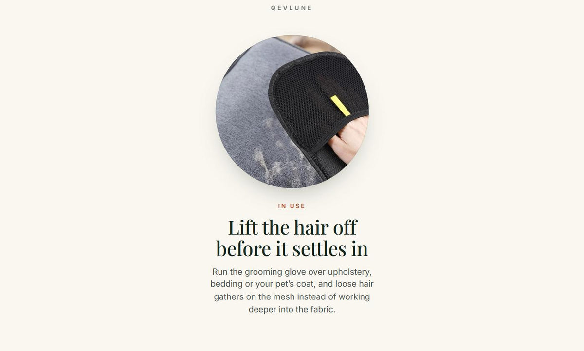 The grooming glove in use, lifting loose pet hair from a hair-covered grey sofa